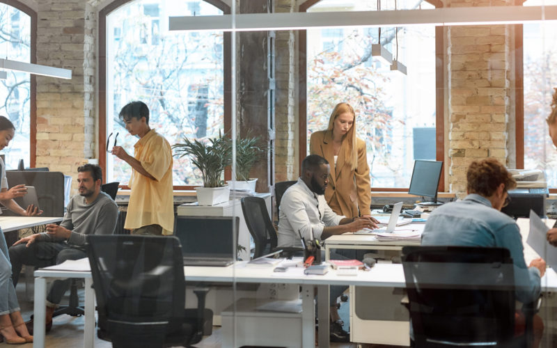 Group of young mixed race business people working together in the creative office. Team building concept. Office life. Cooperation